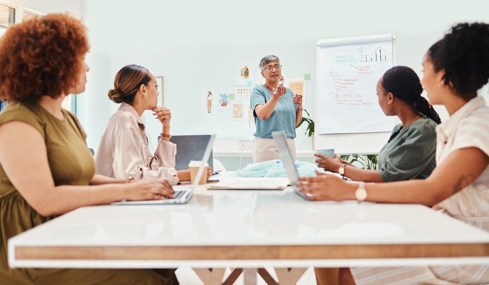 woman speaking to a room full of local seo experts